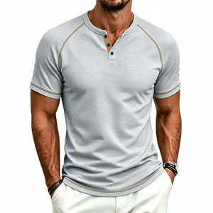 Detail of men's waffle knit Henley shirt with raglan sleeves and contrast piping