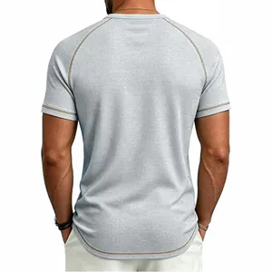Back view of men's grey waffle-knit t-shirt with contrast raglan sleeve stitching