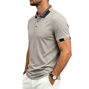 Detailed side view of a men's grey quick-dry polo shirt with contrast striped collar.
