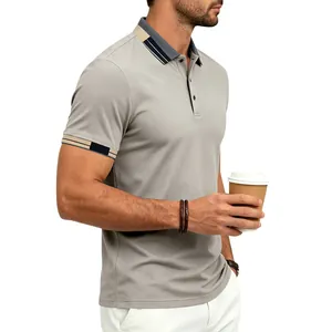 Side view of a grey men's polo shirt featuring navy and tan contrast collar detail