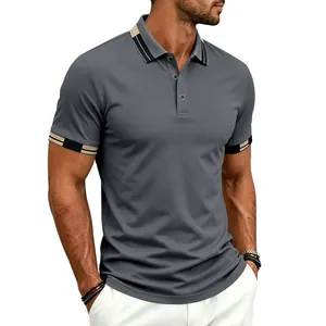 Close-up view of a men's athletic fit grey polo shirt with contrast collar and cuffs