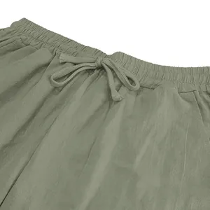 Close-up detail of men's casual linen pants with drawstring elastic waistband