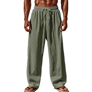Full length view of men's loose sage green breathable linen pants with drawstring waist
