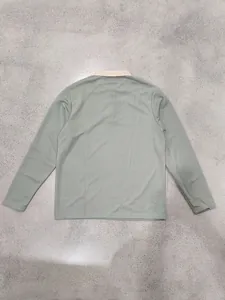 Back view of men's sage green long-sleeved Polo shirt with beige ribbed collar