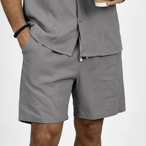 Casual men's grey linen shorts with drawstring elastic waist and matching shirt outfit
