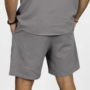 Rear view of men's casual grey linen shorts with elastic waist for summer beach wear.