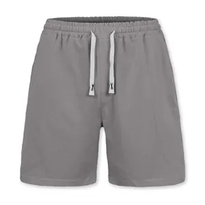 Detail view of grey men's linen shorts featuring a drawstring and elastic waistband.