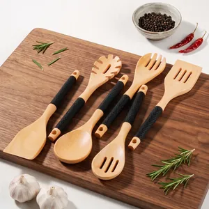 Premium oak kitchen utensil set with ergonomic black silicone handles on wood board
