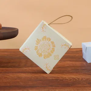 Sunflower paper candy box detail, square wedding gift box with handle, cute return gift packaging.