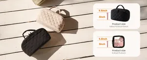 Quilted cosmetic bag large capacity travel makeup pouch with top handle and secure zipper closure.