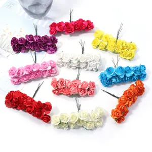 Detailed close-up of colorful artificial paper rose flowers with stems for DIY crafts and decor.