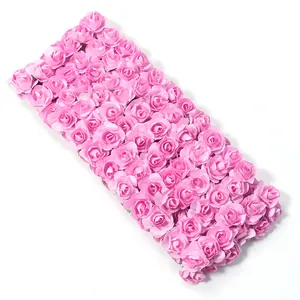 Detailed view of artificial pink rose flower wall panel, dense floral decor for wedding event backdrop.