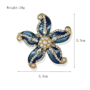 Detail of vintage starfish brooch with 3.3cm measurements and pearl accents
