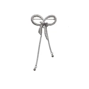 Vintage silver metal bow knot brooch with elegant hanging tassels for women suit accessories