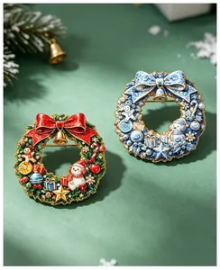 Detail view of colorful Christmas wreath brooches with snowman and bell motifs
