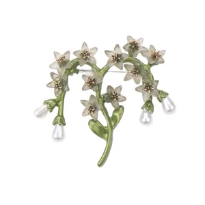 Elegant vintage flower branch brooch with green leaves and hanging teardrop pearls
