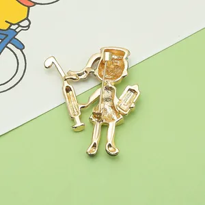 Detailed back view showing the pin fastener of a golden cartoon nurse medical brooch