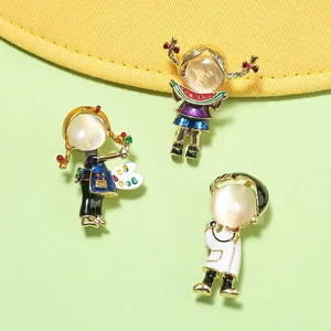 Detail view of creative cartoon brooches featuring cat's eye stones and enamel finish