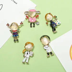 Cartoon profession brooches set with doctor and nurse designs featuring cat's eye stone