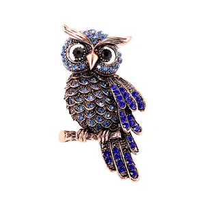 Eleganter Vintage-Eulen-Brosche mit luxuriösen blauen Strasssteinen und Antikgold-Finish