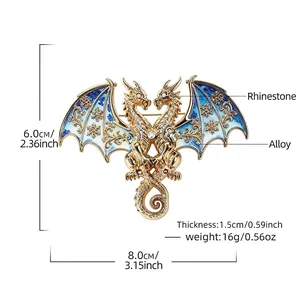 Exquisite double-headed dragon brooch with blue enamel wings and sparkling rhinestones.