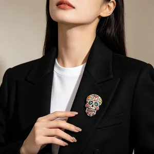 Mexican Day of the Dead colorful sugar skull brooch pinned on a black blazer for Halloween
