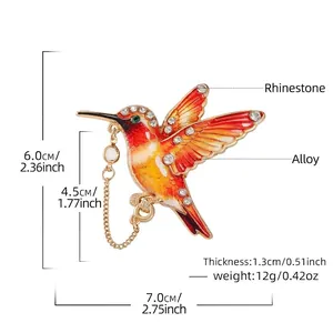 Elegante kolibrie broche met kleurrijk verloop en kristallen accenten