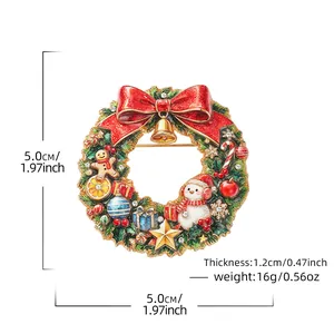 Festive Christmas wreath brooch with snowman, bell, and red bow, 1.97-inch diameter design