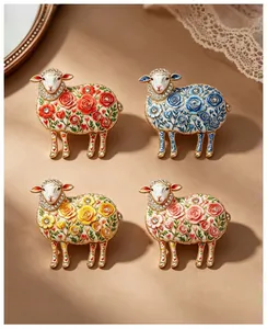 Artistic vintage sheep brooches featuring colorful floral patterns and rhinestone accents