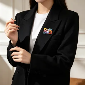 Halloween themed ghost and pumpkin letter BOO brooch pin accessory on black blazer