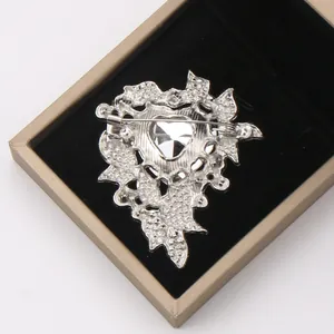 Back view detail showing the pin mechanism of a luxury silver heart-shaped brooch