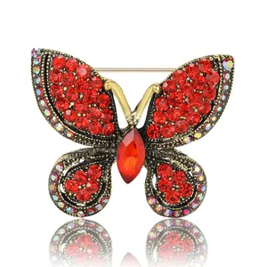 Élégante broche papillon vintage en alliage avec strass rouges et reflet miroir brillant