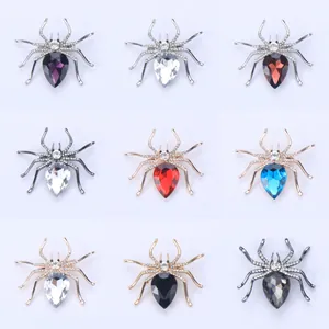 Detail view showing various colors of rhinestone spider brooches for Halloween