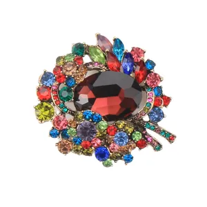 Vintage European style crystal brooch with large red center stone and multicolor accents