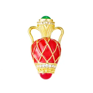 Vintage court style gold amphora brooch with red enamel lattice and white crystals