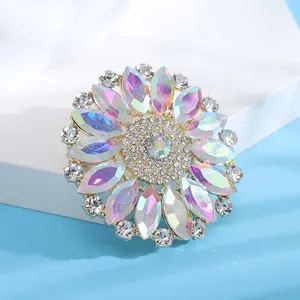 Macro view of a vintage flower brooch with iridescent AB crystal rhinestones.