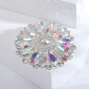 Close-up of vintage round AB colorful glass rhinestone flower brooch for coats.