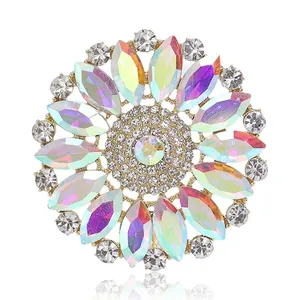 Elegant vintage round floral brooch featuring iridescent AB rhinestones in gold finish