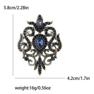 Vintage baroque hollow alloy brooch with blue rhinestones and dimensions shown
