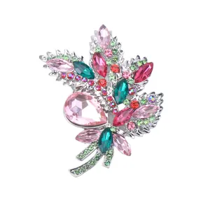 Elegant crystal floral bouquet brooch with sparkling pink and green stones for suits