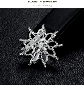 Rear view of silver alloy flower brooch showing the secure pin fastening mechanism detail