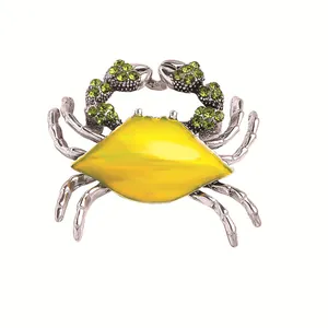 Exquisite silver-tone crab brooch pin with vibrant yellow enamel and green rhinestones