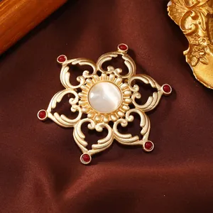 Vintage hollow lotus flower brooch pin with white gemstone center and red bead accents