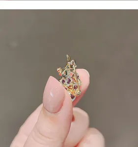 Detailed view of the secure back clasp and golden metal base of the grape brooch.