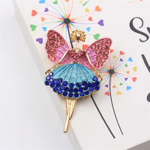 Macro shot of an elegant ballerina fairy brooch featuring sparkling pink and blue rhinestones.