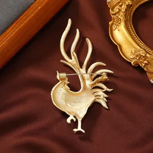 Detailed back view of a golden rooster brooch pin, elegant animal zodiac accessory