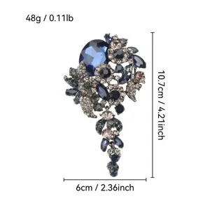 Detailed view of large vintage blue crystal tassel brooch with precise size measurements in cm and inch