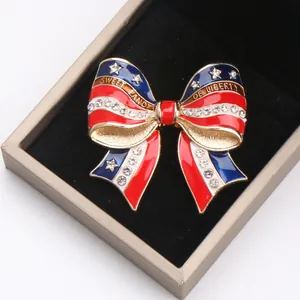 Detailed view of an American flag themed bow brooch with rhinestones and engraving