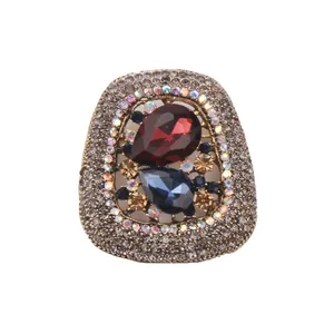 Vintage crystal brooch with teardrop red and blue stones and rhinestone encrusted frame