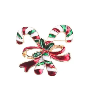 Festliche Weihnachts-Zuckerstangen-Brosche mit roter Strassschleife und Stechpalme